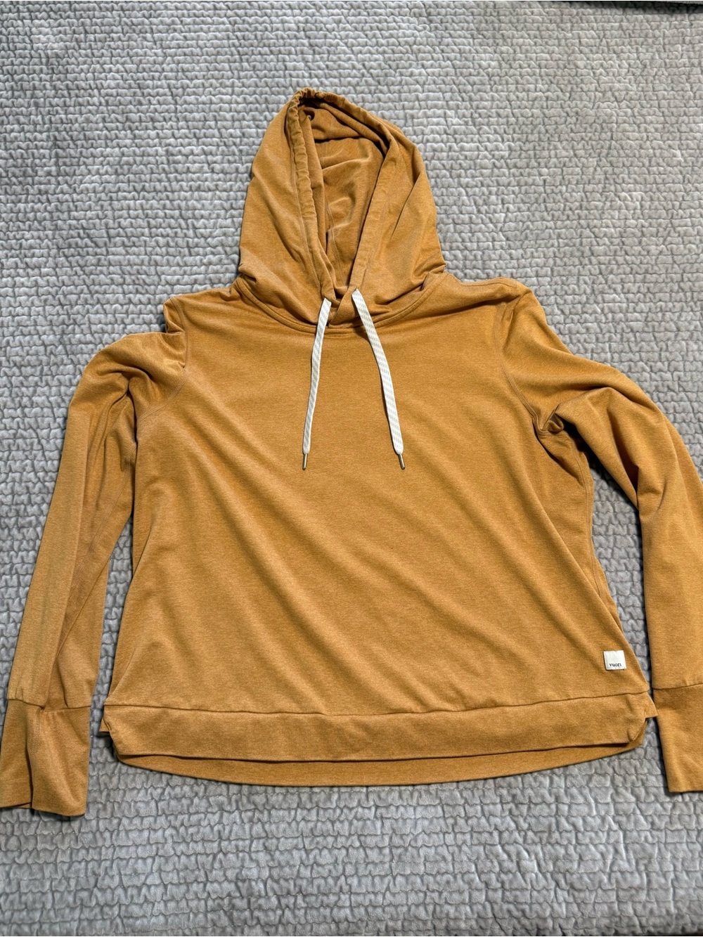 Vuori Halo Essential Hoodie in mustard yellow.